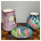 (3pc) FLORAL CERAMIC PITCHERS & BOWL  |  Two ceramic pitchers, one with sculpted grape design and si