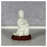 kneeling Quan Yin figure mounted to a conforming wood stand - h. 7.5 in. (vase)