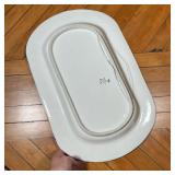 Faience pottery platter decorated with a bird and deer in a landscape, stamped on verso - l. 20.5 x 