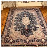 FRENCH STYLE CARPET  |  Central medallion on an indigo field within shaped concentric borders - l. 8