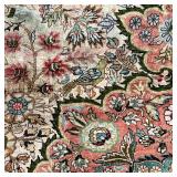 Finely woven silk carpet, intricately decorated, with borders of birds, flowers, and leaves and vine