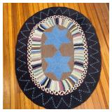 OVAL HOOKED MAT  |  With two blue stars within colorful borders - l. 4 x w. 3 in.