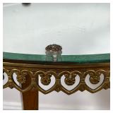 BRASS SIDE TABLE  |  Having an oval mirrored top, with a medial glass shelf - l. 18 1/2 x w. 11 3/4 