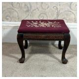 NEEDLEPOINT FOOTSTOOL  |  Small foot rest with a floral needlepoint top, the wood frame with floral 
