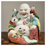 HAPPY BUDDHA PORCELAIN FIGURE  |  Chinese porcelain figure of a smiling Buddha, with five children c