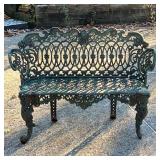 GARDEN BENCH  |  Highly decorated outdoor bench with acanthus knees, figural backrest with flowers a
