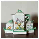 JAPANESE CONDIMENT SET  |   Of small size, with two pots, a lidded sugar jar, and two shakers. Each 