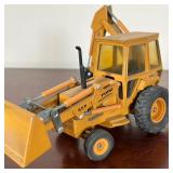 DIE CAST FORD 555 BACKHOE  |   Vintage model backhoe tractor, 1980s - l. 10 in.
