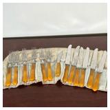 GROUP OF BAKELITE FLATWARE  |   Knives and forks with Bakelite handles