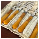 GROUP OF BAKELITE FLATWARE  |   Knives and forks with Bakelite handles