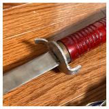 SWORD & SHEATH  | With a red painted wood handle and sheath - l. 33 in.