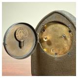 TIFFANY ZODIAC CLOCK  |   Tiffany Studios New York desk clock with an arched bronze case, having zod