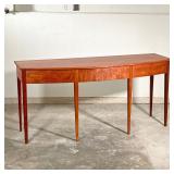 THOMAS MOSER SIDEBOARD  |   Figured American cherry wood, having a bowed front with three drawers ra