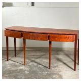 THOMAS MOSER SIDEBOARD  |   Figured American cherry wood, having a bowed front with three drawers ra