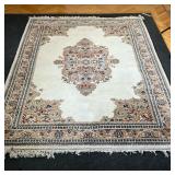 MEDALLION CARPET  |   Hi pile with a central medallion on a cream ground, with scrolls in blue and t