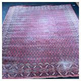 ANTIQUE RUG  | With even field of guls on a red ground - l. 134 x w. 91 in.