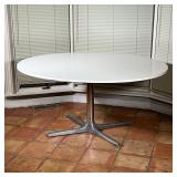 RETRO OVAL TABLE  | Having a white laminate oval top mounted on a stainless post on a cast aluminum 