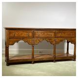BAKER CONSOLE TABLE  | Long hall table or sideboard, having three drawers over an open shelf with co