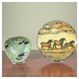 (2pc) ANIMAL POTTERY PLATES  | One glazed plate showing what appears to be horses on a field, and th