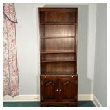 WOODEN BOOKCASE  | Dark wood bookcase with four adjustable shelves over a pull out writing surface o