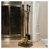 FIREPLACE TOOLS  | Three fireplace tools on a matching stand, of heavy polished / brushed metal - h.