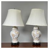 (2pc) PAIR GILT PORCELAIN LAMPS | Of ginger jar form, decorated with blossoming flowers, on wood