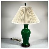 CERAMIC JADE TABLE LAMP | Ceramic jade colored table lamp (monochrome green) on a carved wooden base