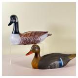 (2pc) HAND PAINTED DECOYS | A pair of hand painted wooden waterfowl decoys; one Canadian goose