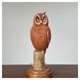 "BUD K" CARVED OWL | With matching stand, signed on the bottom; owl h. 8.5 in - overall l. 8 x w. 6