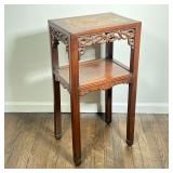 CHINESE SIDE TABLE | Inset stone top with open scrollwork decoration and a medial shelf - l. 16 x w.