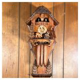 WINTER LODGE CUCKOO CLOCK | Edelweiss cuckoo clock featuring a winter lodge scene,with Roman numeral