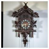 CARVED OAK CUCKOO CLOCK |Crested by a carved deer with leaves over an open clock face with Roman num