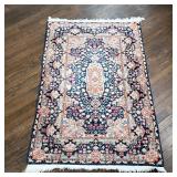 SCULPTED RUG | Having patterns of vines, flowers, and scrolls on a deep blue background - l. 60 x w.