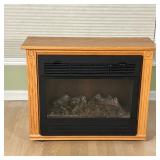 ELECTRIC FIREPLACE | Heat Surge Electric Fireplace Model ADL-2000M-X; with placard that reads "Hand-