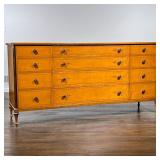 SCHMEIG & KOTZIAN LONG DRESSER | Tiger maple chest of drawers with concave front, inlaid in 