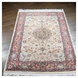 SCULPTED ANIMAL KIRMAN CARPET | Having a central medallion on a cream field, surrounded by tigers