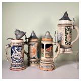 (4pc) METTLACH STEINS | Four Mettlach steins from Germany, finely sculpted and decorated