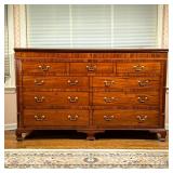 UNUSUAL LIFT TOP SIDEBOARD | Inlaid in contrasting woods, reeded corners on bracket feet;