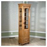 LIGHT PINE NARROW DISPLAY CABINET | Glazed glass door and sides, carved terminals, with a single low