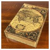 BOOK SAFE | The outside bound with a map, lifting to reveal a soft lined interior, no apparent maker