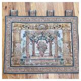 FLORAL ARBOR TAPESTRY | Needlepoint tapestry showing flowers in an urn amongst columns in a