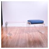 KAGAN STYLE LUCITE BENCH | Having a single seat with an upholstered cushion next to an extended low 