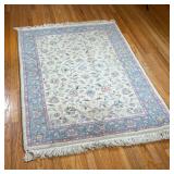SMALL FLORAL RUG | Floral rug with tan field and blue and pink border - l. 71 x w. 47 in.  
