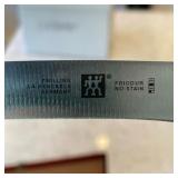 eight knives in wood case; knife end to end is 9 in. and blade is 5 in. - l. 15 x w. 5 x h. 2 in. 