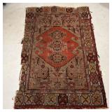 ANTIQUE CAUCASIAN RUG | Of small size, with central medallion Dimensions: 64 x 39 in. 