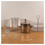 (4PC) GLASS & OTHER TABLE ITEMS | Including a silver plated ice bucket, a two tiered pressed glass d