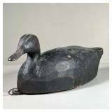 BLACK DUCK DECOY | Chip carved wood decoy duck, black paint, metal ring and lead weight on the botto