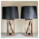 (2PC) CONTEMPORARY WOOD LAMPS | Pair of contemporary wood table lamps with black shades over x-form 