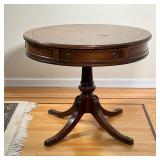 BRANDT FURNITURE DRUM TABLE | Having a single drawer on a quadruped base; h. 26 x dia. 32 in 