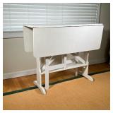 DROP-LEAF TABLE | White painted drop leaf table with leaves on both sides. Leaf length: 12in. - l. 1